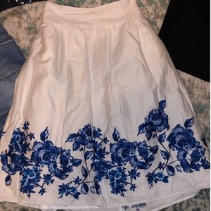 White skirt with blue floral patterns